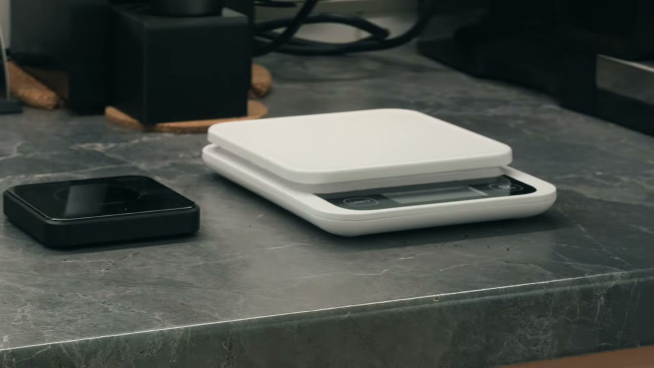 Bookoo Themis Mini and MyScale on my counter, a frame from my comparison video